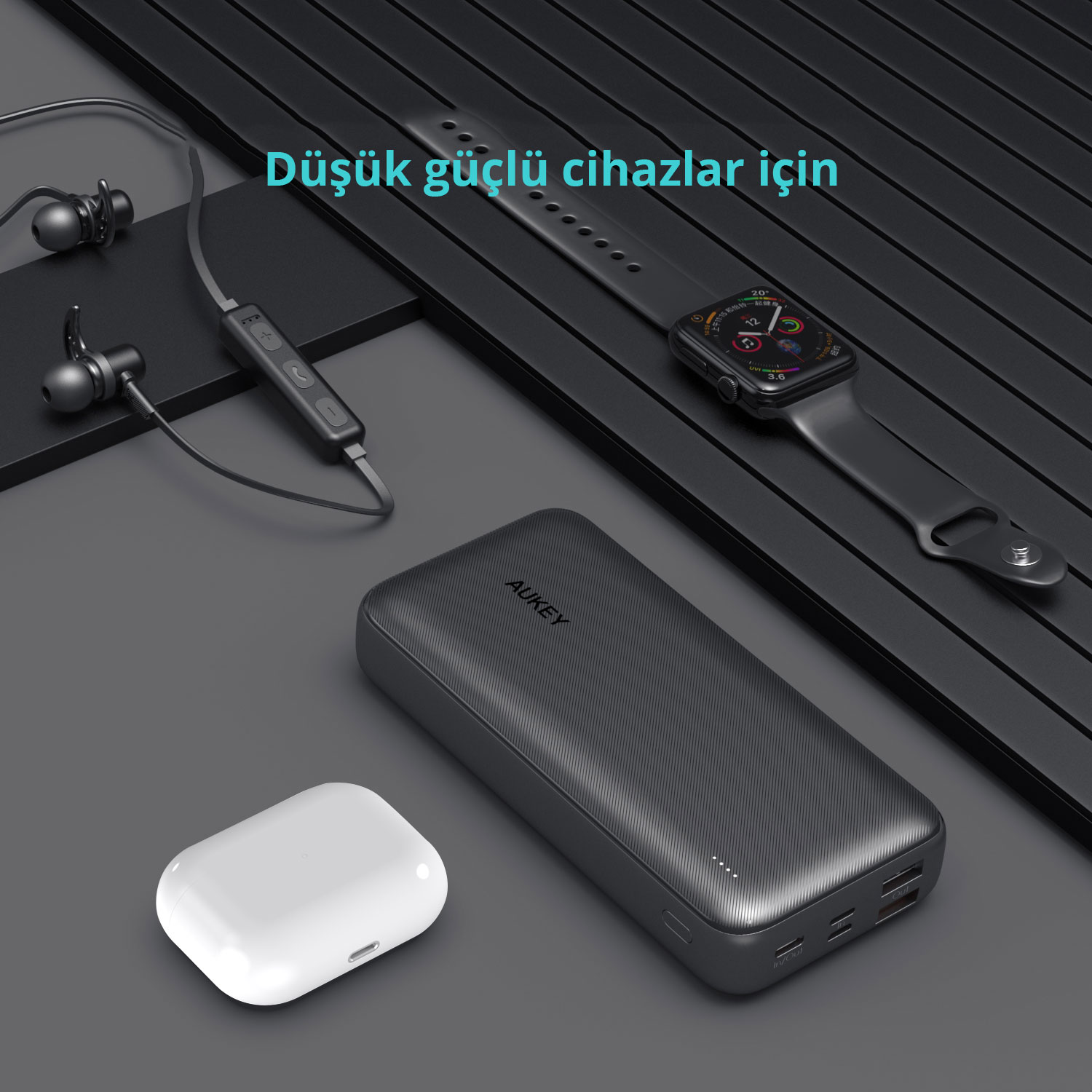 Siyah powerbank, kablosuz kulaklık, akıllı saat ve kablolu kulaklık.