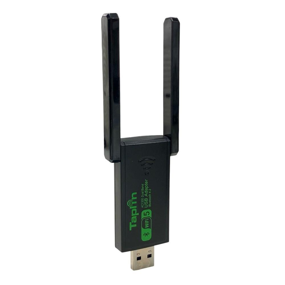 Beyaz arka planda çift antenli siyah bir Tap-Fi Wi-Fi USB adaptörü.