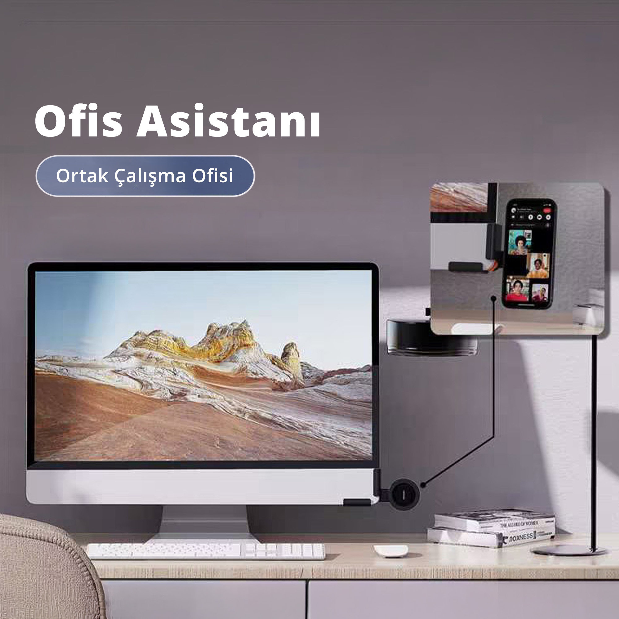 Manzara duvar kağıtlı bilgisayar monitörü, klavye ve görüntülü arama gösteren telefon tutucu.