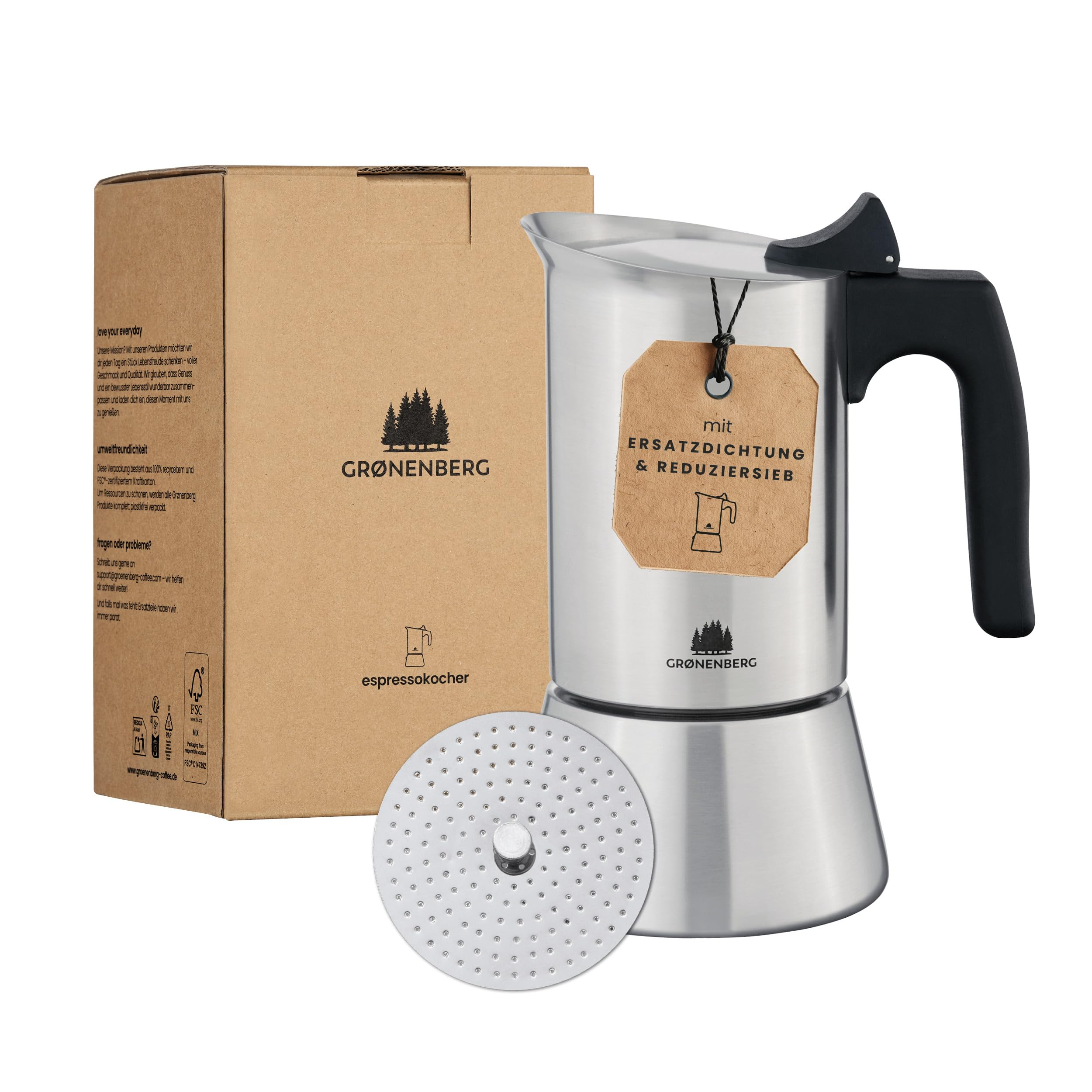 Une cafetière espresso argentée avec une poignée noire à côté de sa boîte en carton et d'un disque filtre.