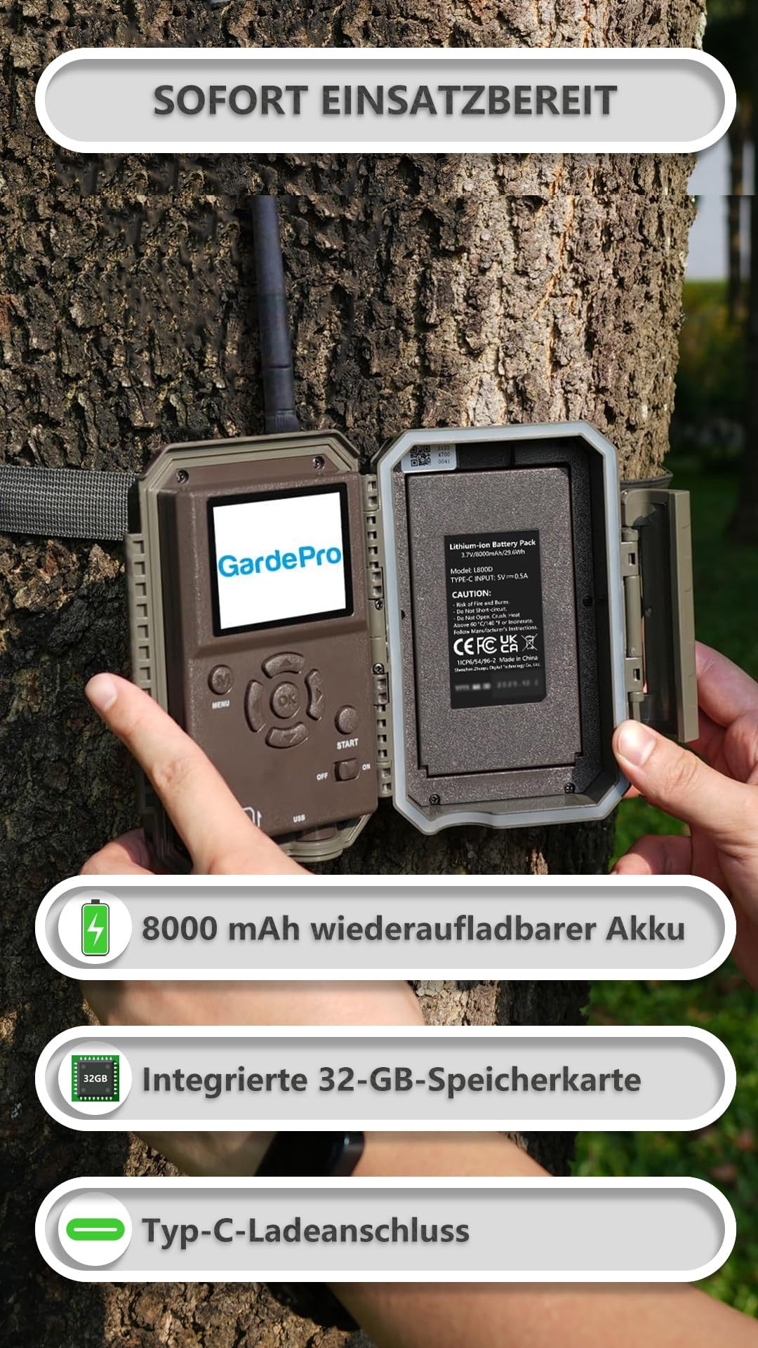 Fotocamera per fauna GardePro aperta montata su un albero con batteria e schermo.
