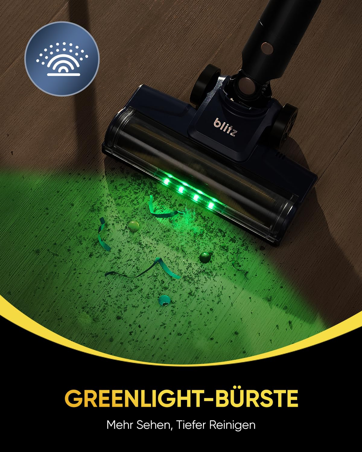 Una testina di aspirapolvere nera con luci LED verdi luminose che rivelano polvere su un pavimento in legno.
