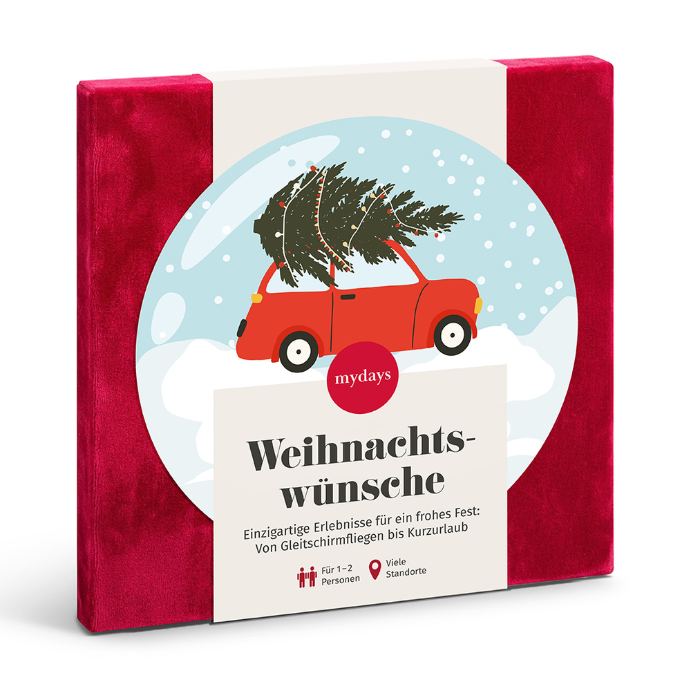 Rote Geschenkbox mit einer Banderole, die ein rotes Auto mit Weihnachtsbaum zeigt.