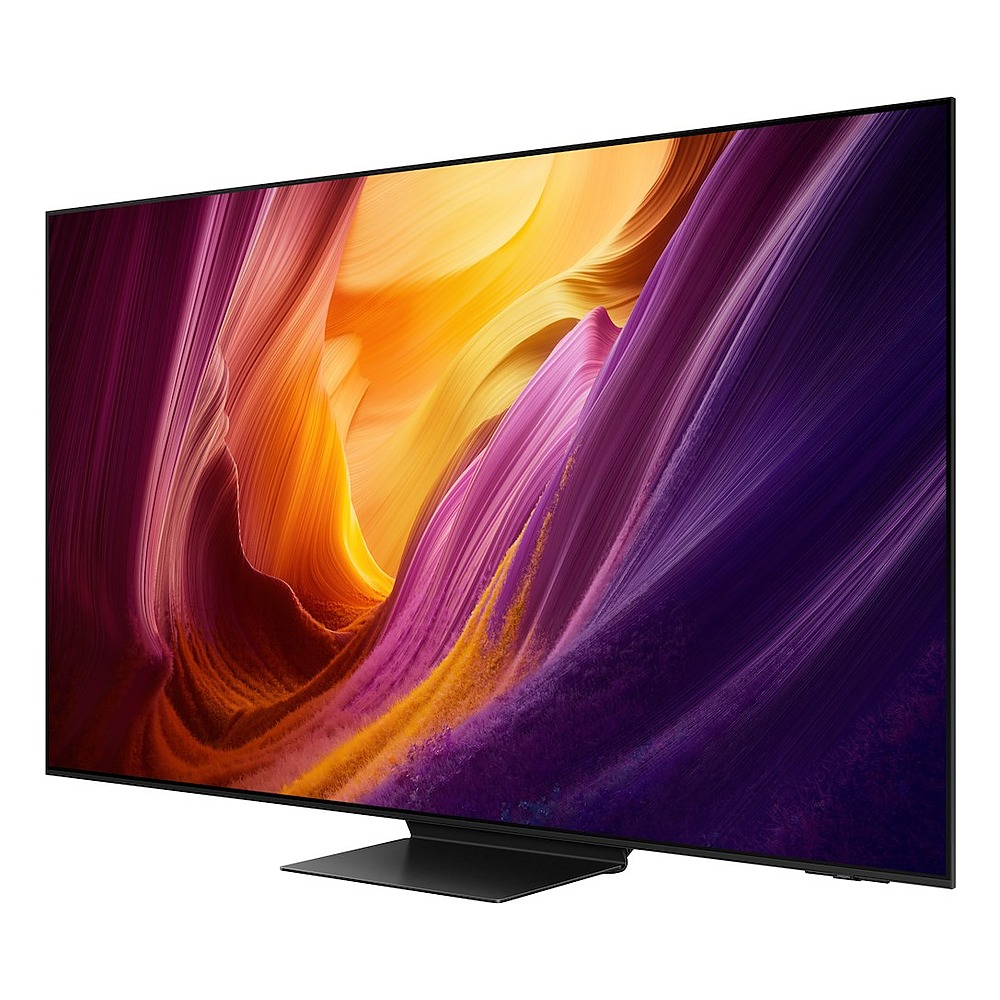 Telewizor płaskoekranowy z czarną ramką i podstawą wyświetla abstrakcyjny obraz żółto-fioletowego kanionu.