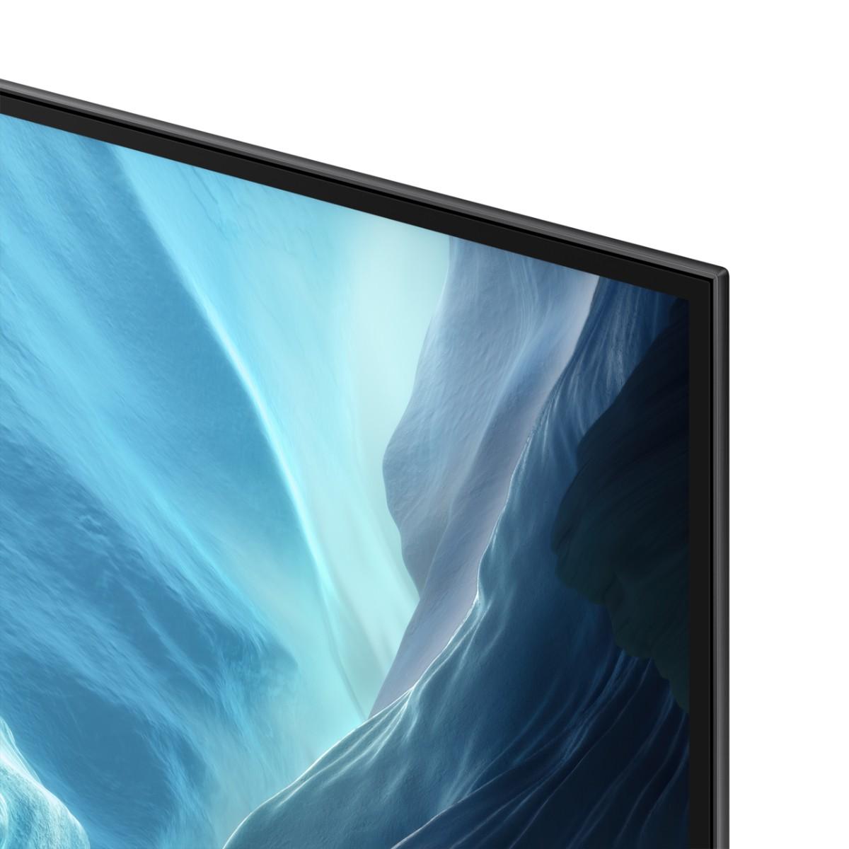 Primer plano de la esquina superior derecha de un televisor moderno con una pantalla abstracta azul y blanca.