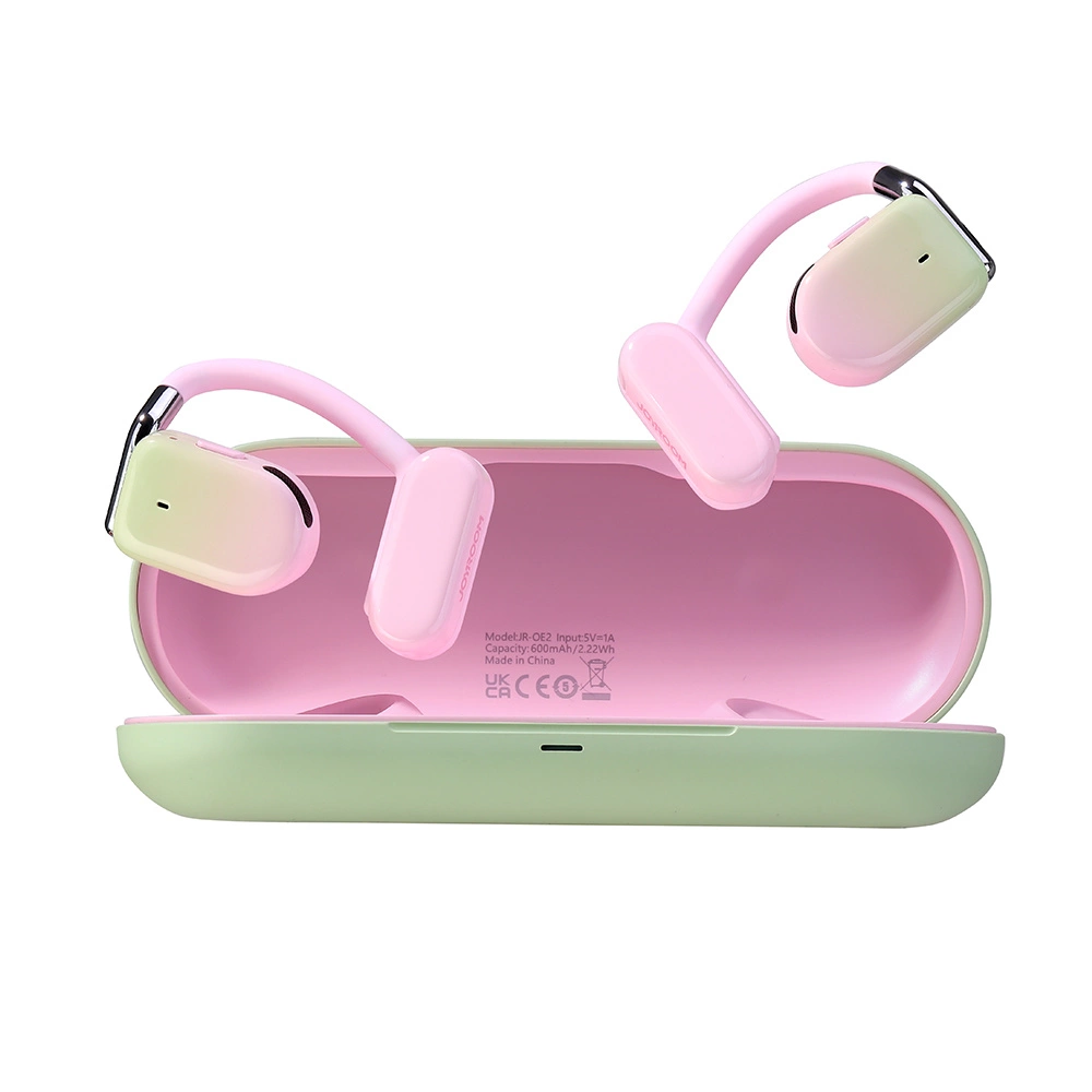 Pink and green wireless open-ear earbuds with a charging case on a white background.