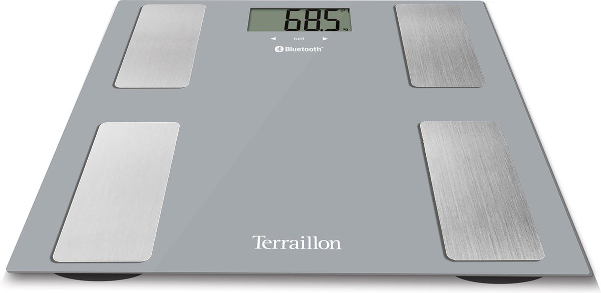 Eine graue Digitalwaage von Terraillon mit vier silbernen Sensorflächen und digitaler Anzeige.