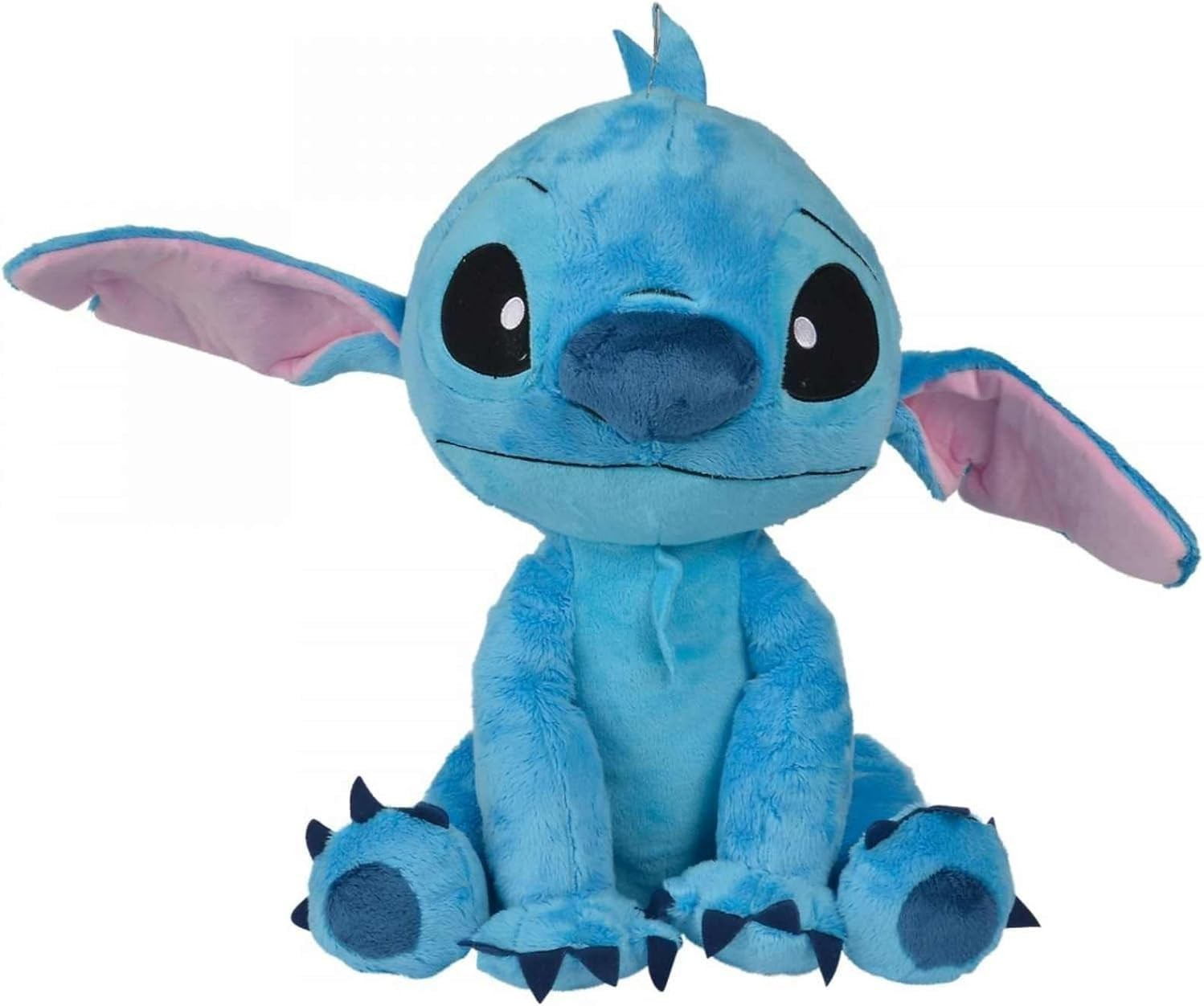 Un peluche azul de Stitch con orejas grandes, ojos negros y orejas rosadas está sentado sobre fondo blanco.