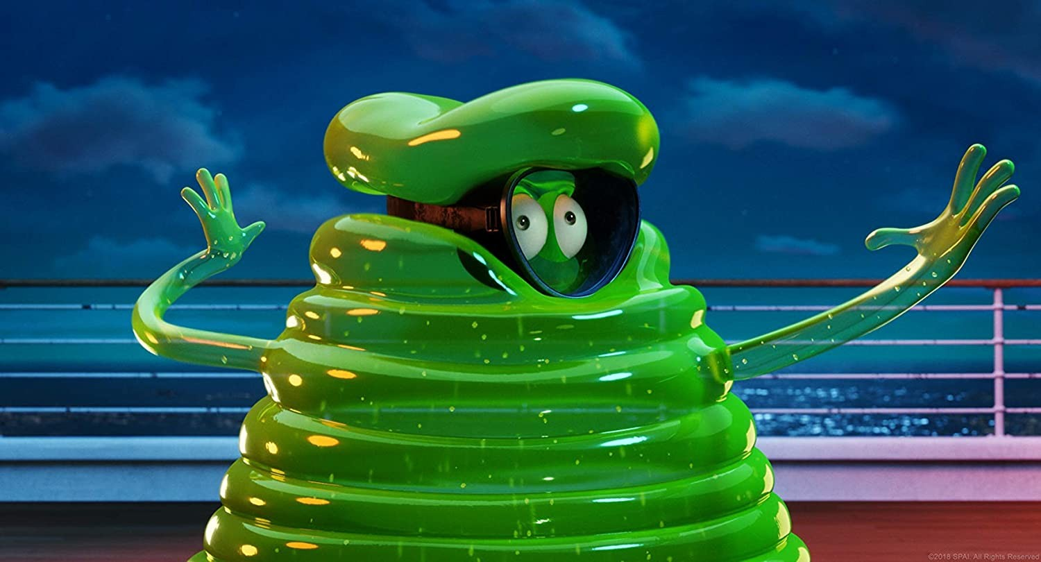 Un simpático personaje gelatinoso verde con gafas saluda con los brazos en un balcón por la noche.
