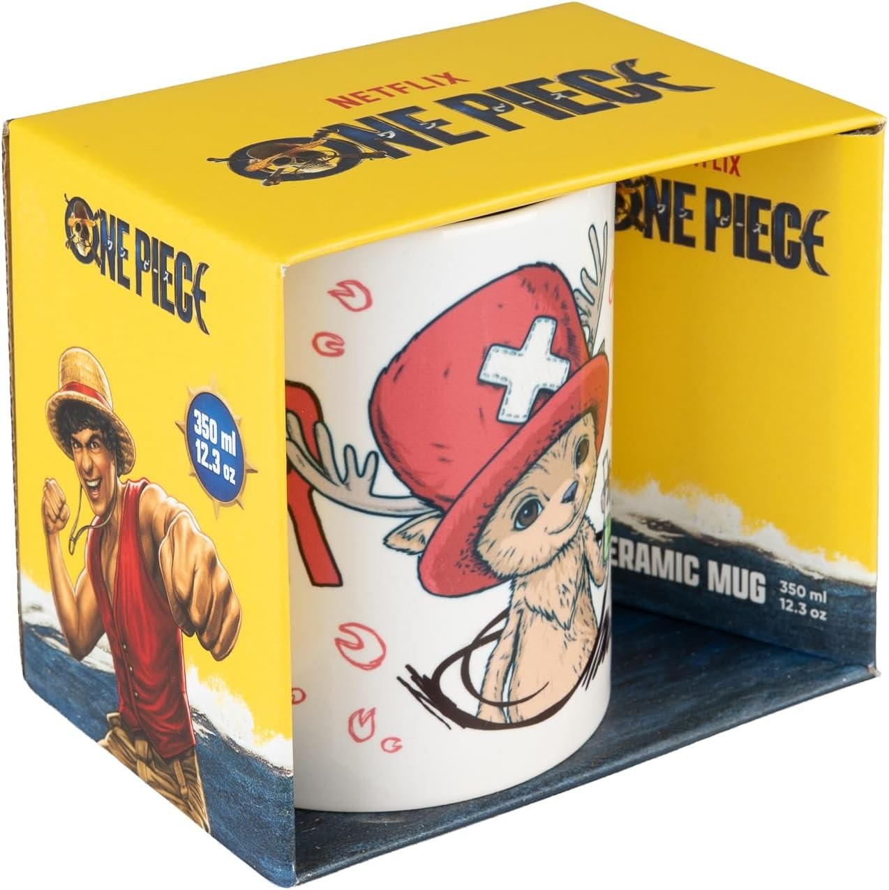 Taza de cerámica de One Piece en caja amarilla y azul, con un personaje con sombrero rojo y astas.