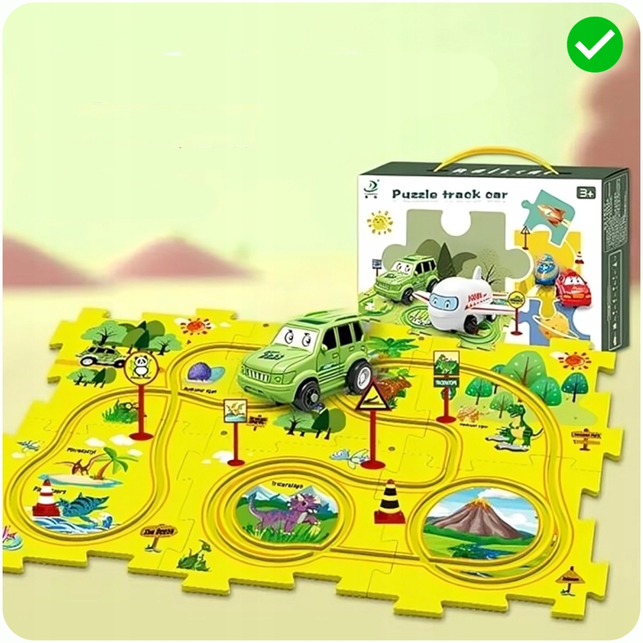 Zestaw autka z torem typu puzzle z zielonym torem, autkiem i pudełkiem na jasnym tle.