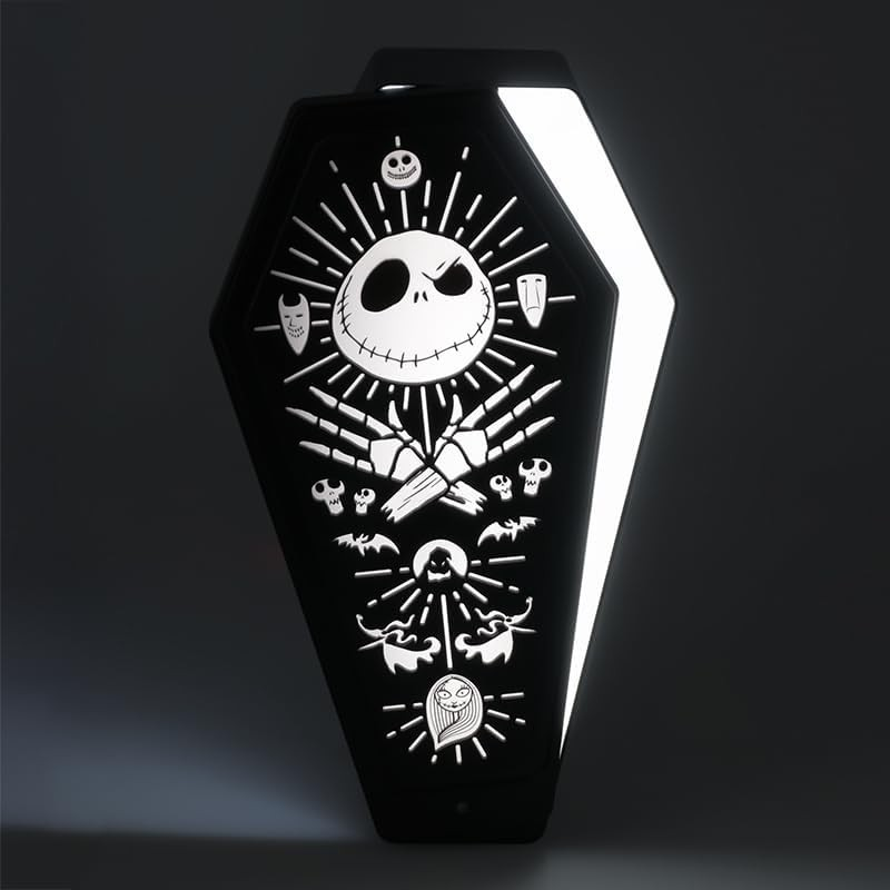 Un estuche negro iluminado con forma de ataúd muestra iconos blancos de Jack Skellington, manos esqueléticas y murciélagos.