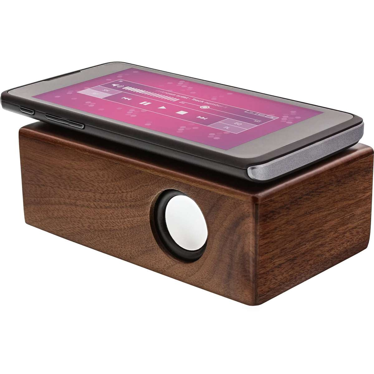 A smartphone playing music rests on a dark wooden audio speaker with a single round white speaker cone on the front.