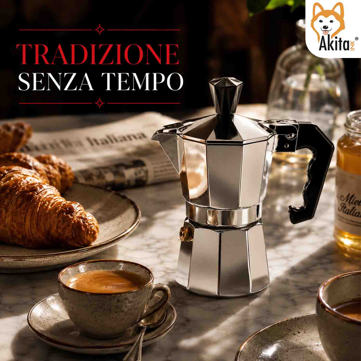 Una lucida moka si trova su un tavolo con cornetti e tazze di caffè.