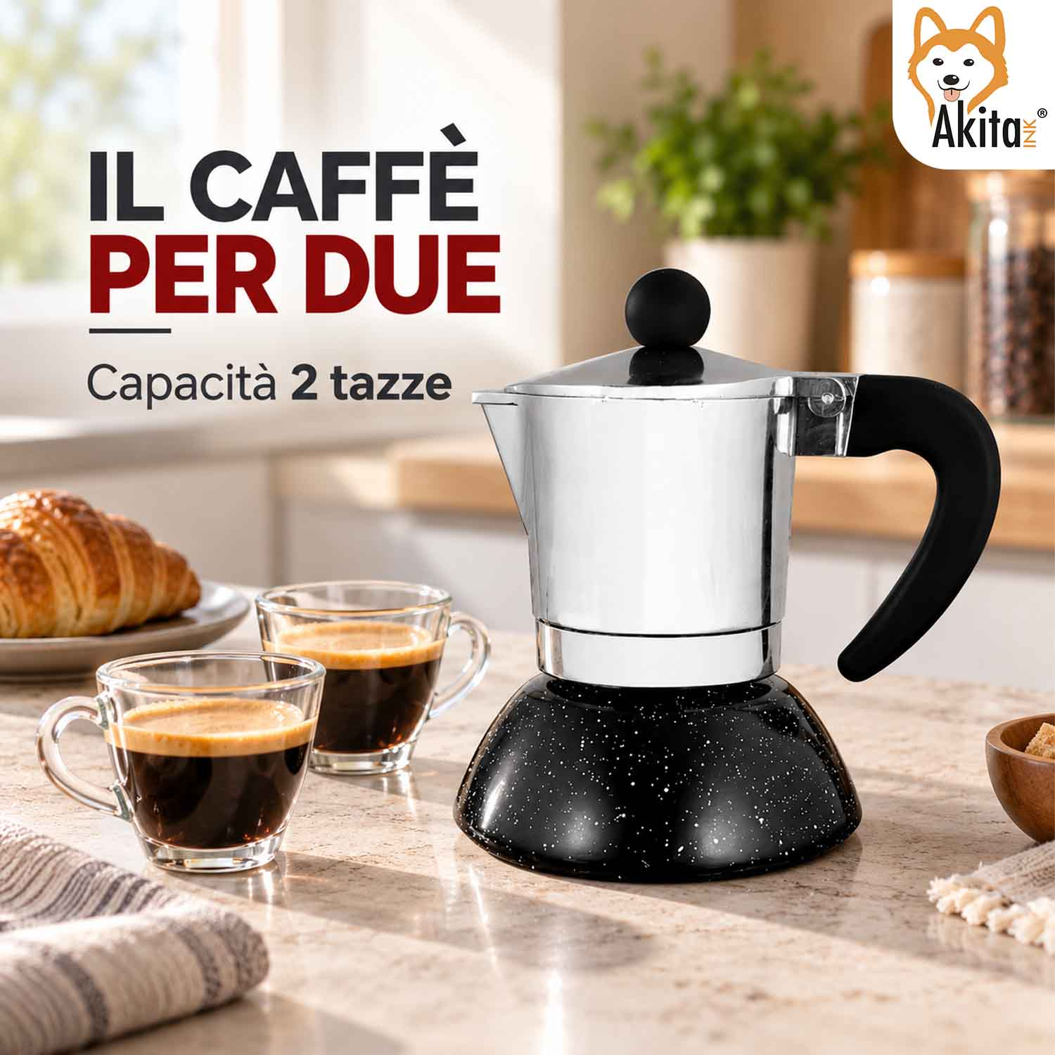 Una moka con due tazze di caffè su un piano cucina.