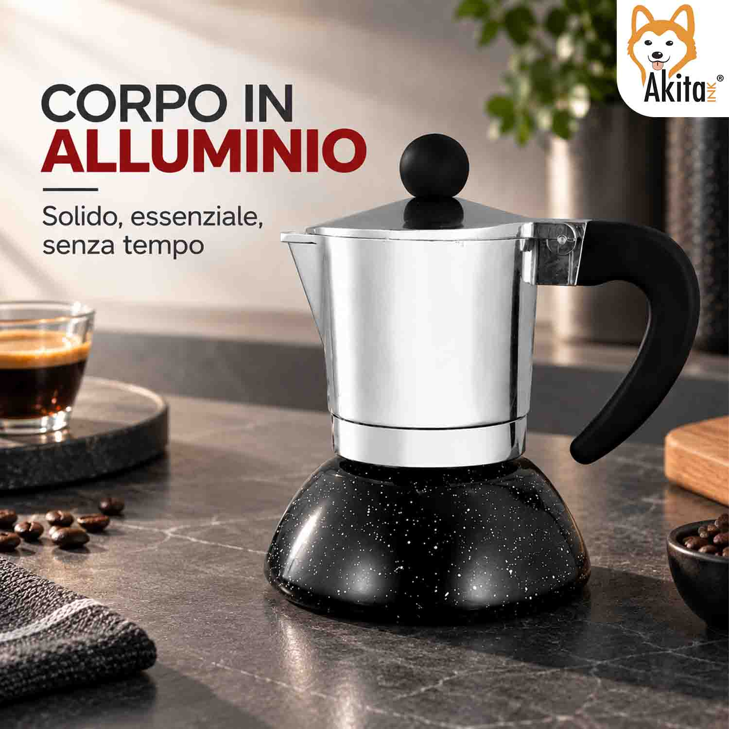 Caffettiera moka in alluminio con base e manico neri su un piano cucina con chicchi di caffè.