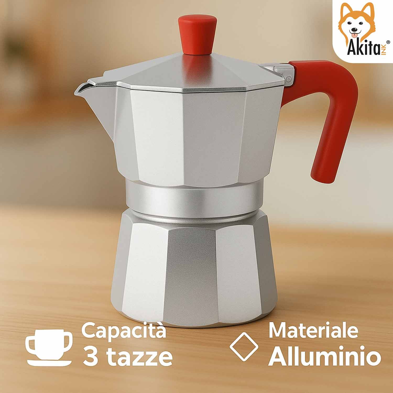 Una caffettiera moka in alluminio argentato con manici rossi su un tavolo di legno.