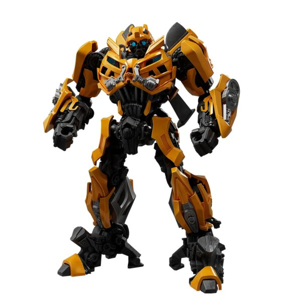Eine gelb-schwarze Transformer-Actionfigur steht vor weißem Hintergrund.