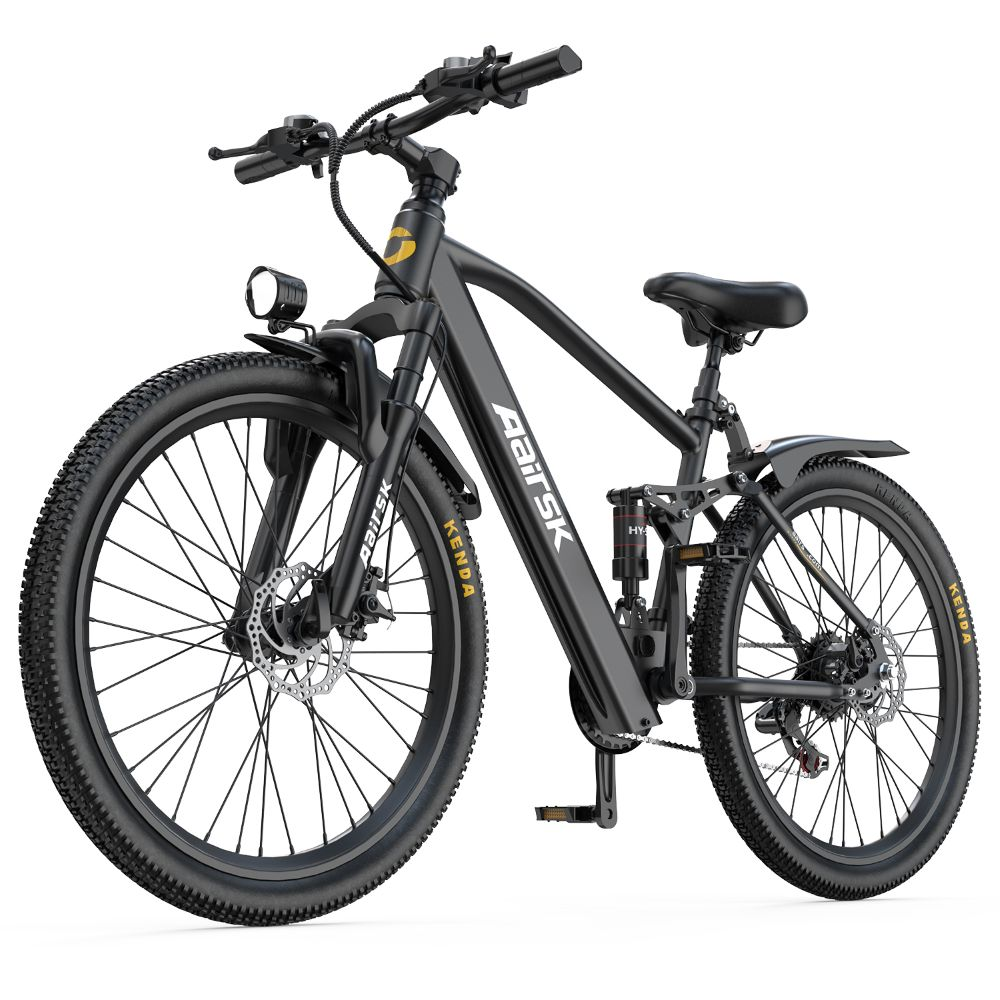 Una bicicleta eléctrica de montaña negra con neumáticos gruesos, suspensión delantera y frenos de disco.