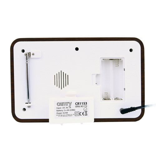 Rückseite einer weiß-braunen Camry CR1153 Uhr mit Antenne, Batteriefach und Stromkabel.