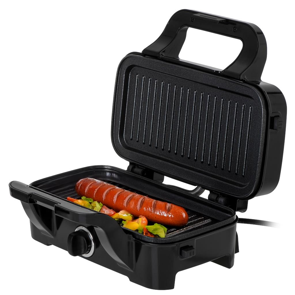Czarny grill stołowy gotuje kiełbaskę i warzywa na żebrowanej płycie.