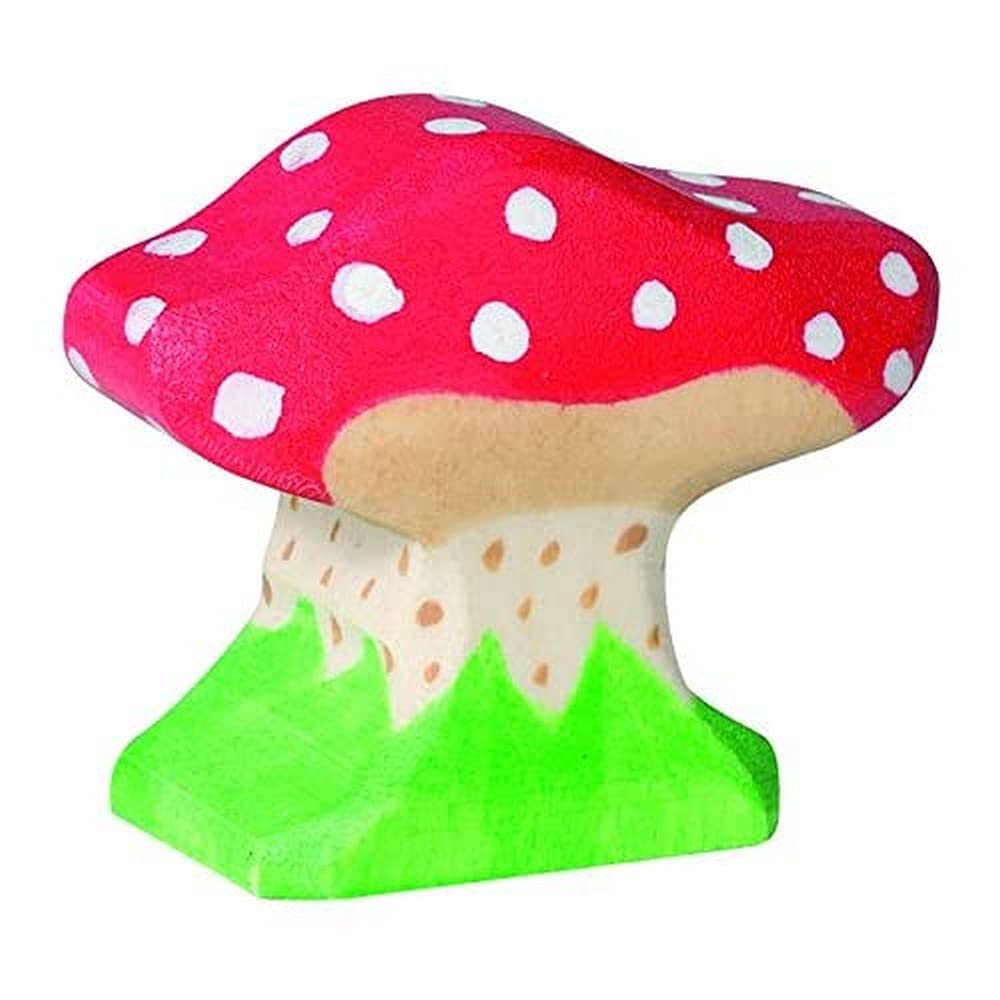 Ein hölzerner Spielzeugpilz mit rotem Hut, weißen Punkten und grünem Sockel auf weißem Hintergrund.