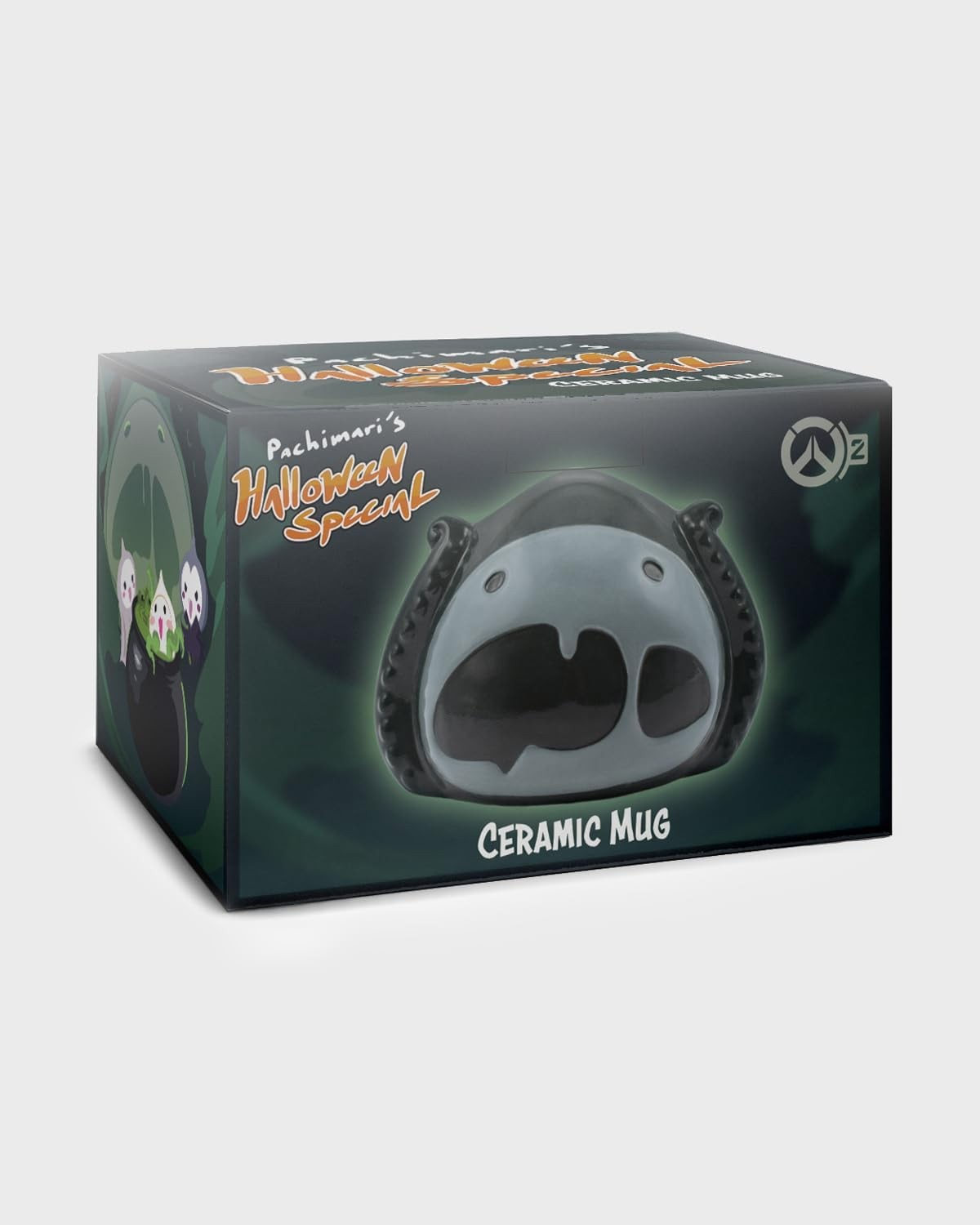 Una taza de cerámica negra en una caja de Halloween Special con tentáculos y gráficos.