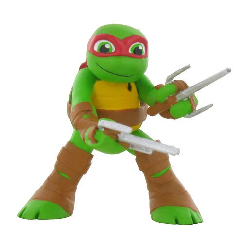Una figura de acción de tortuga verde con máscara roja, caparazón amarillo y armas sai sobre un fondo blanco.