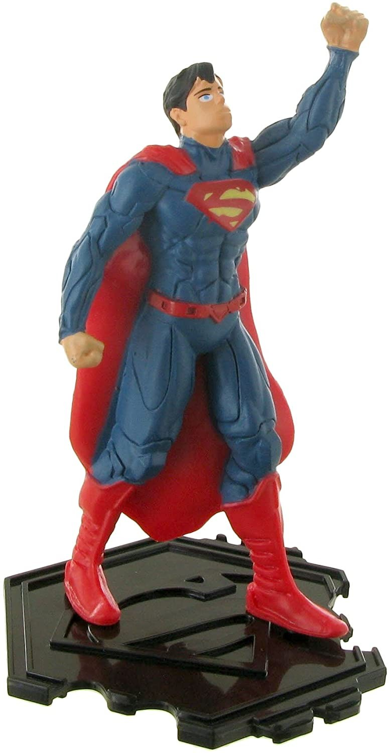 Figura de acción de Superman con capa roja sobre base negra, levantando un puño.