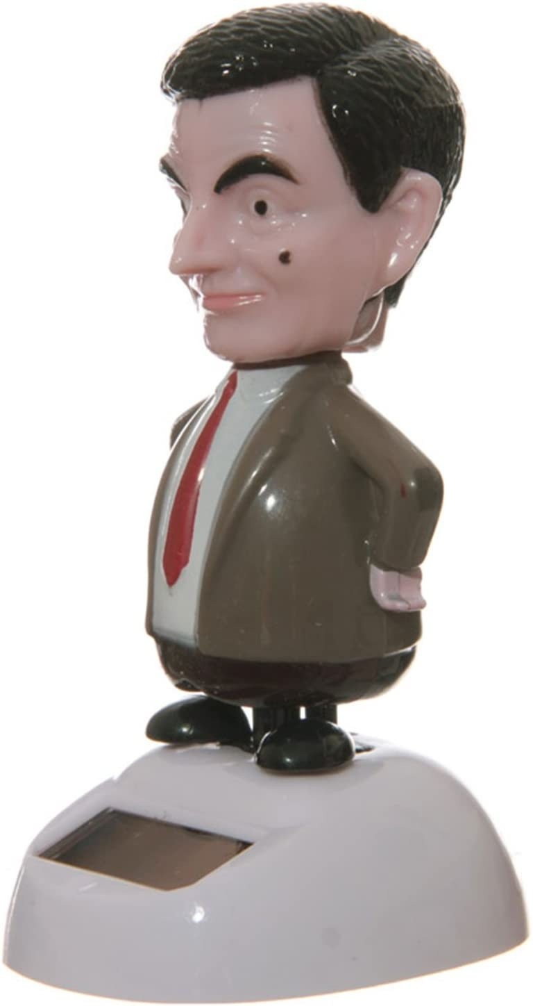 Una figura de Mr. Bean en traje sobre una base solar blanca contra un fondo blanco.