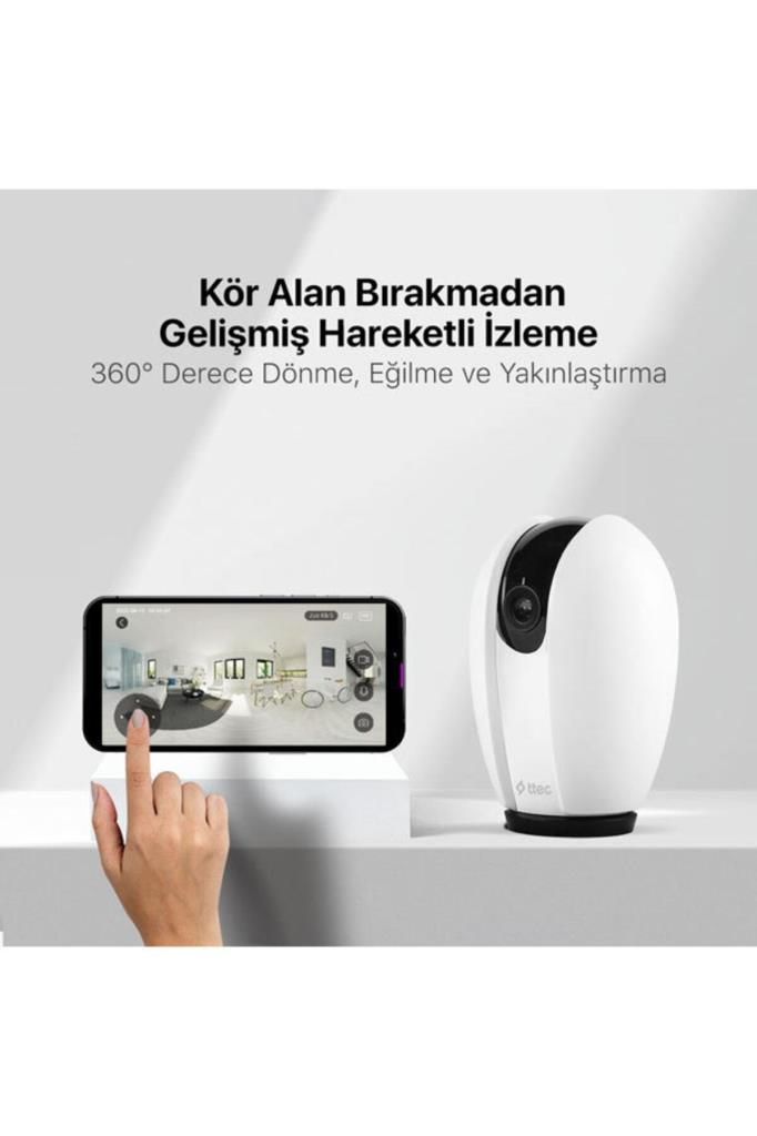 Beyaz güvenlik kamerası ve üzerinde Türkçe yazılar bulunan akıllı telefon ekranı.