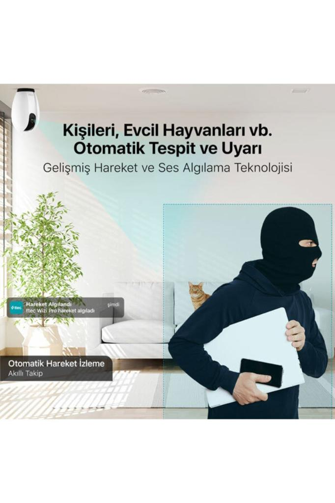 Maskeli bir hırsız, güvenlik kamerasıyla izlenen oturma odasında dizüstü bilgisayar çalar.