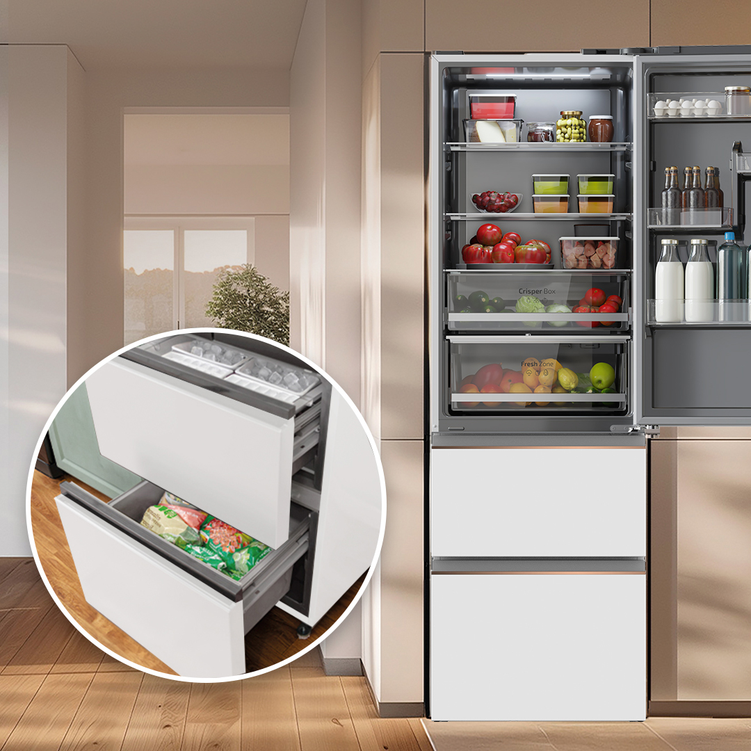 Refrigerador abierto con alimentos y un inserto circular que resalta los cajones del congelador inferiores abiertos.