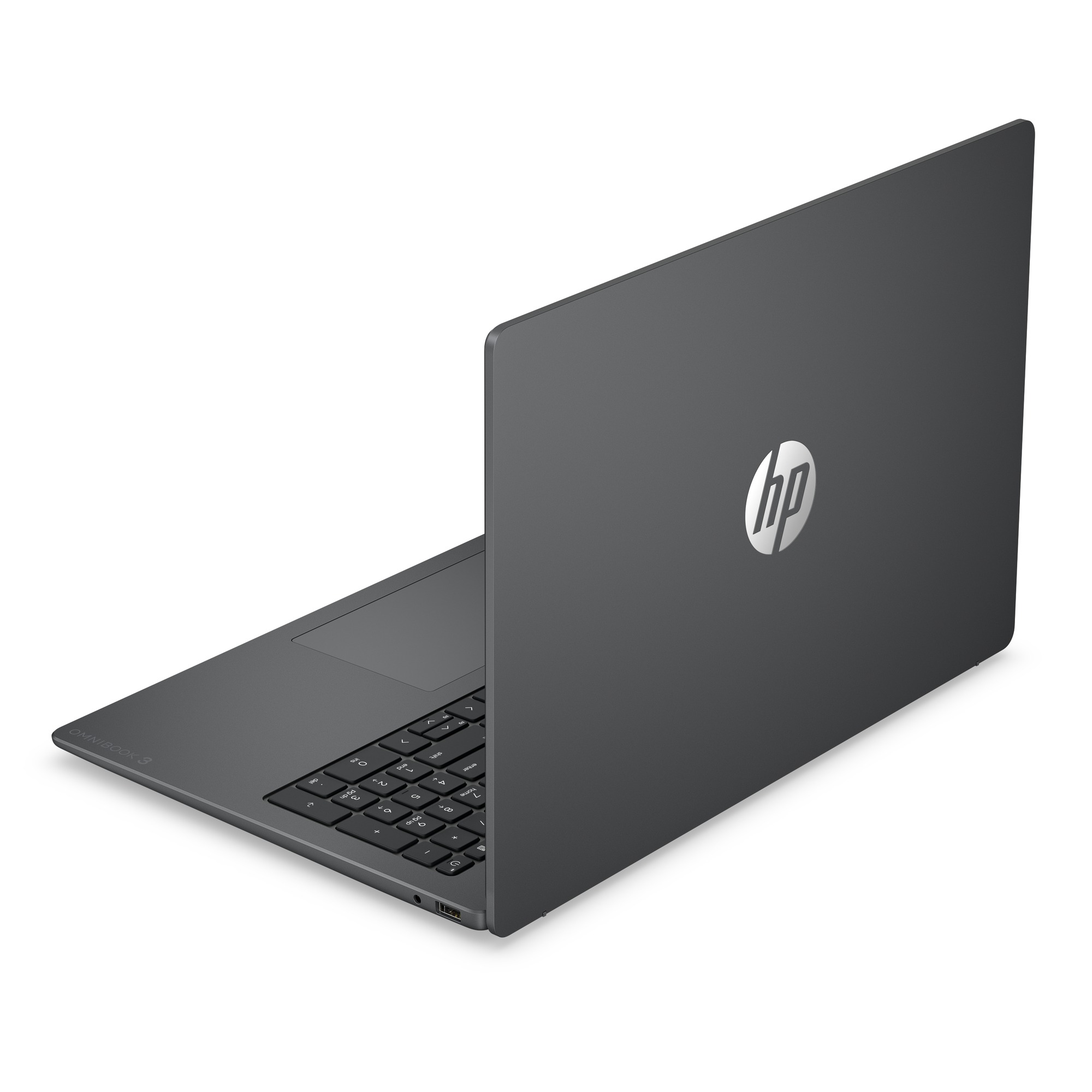 Gri renkli bir HP dizüstü bilgisayar beyaz bir yüzey üzerinde duruyor, kapalı ekranında HP logosu görünüyor.