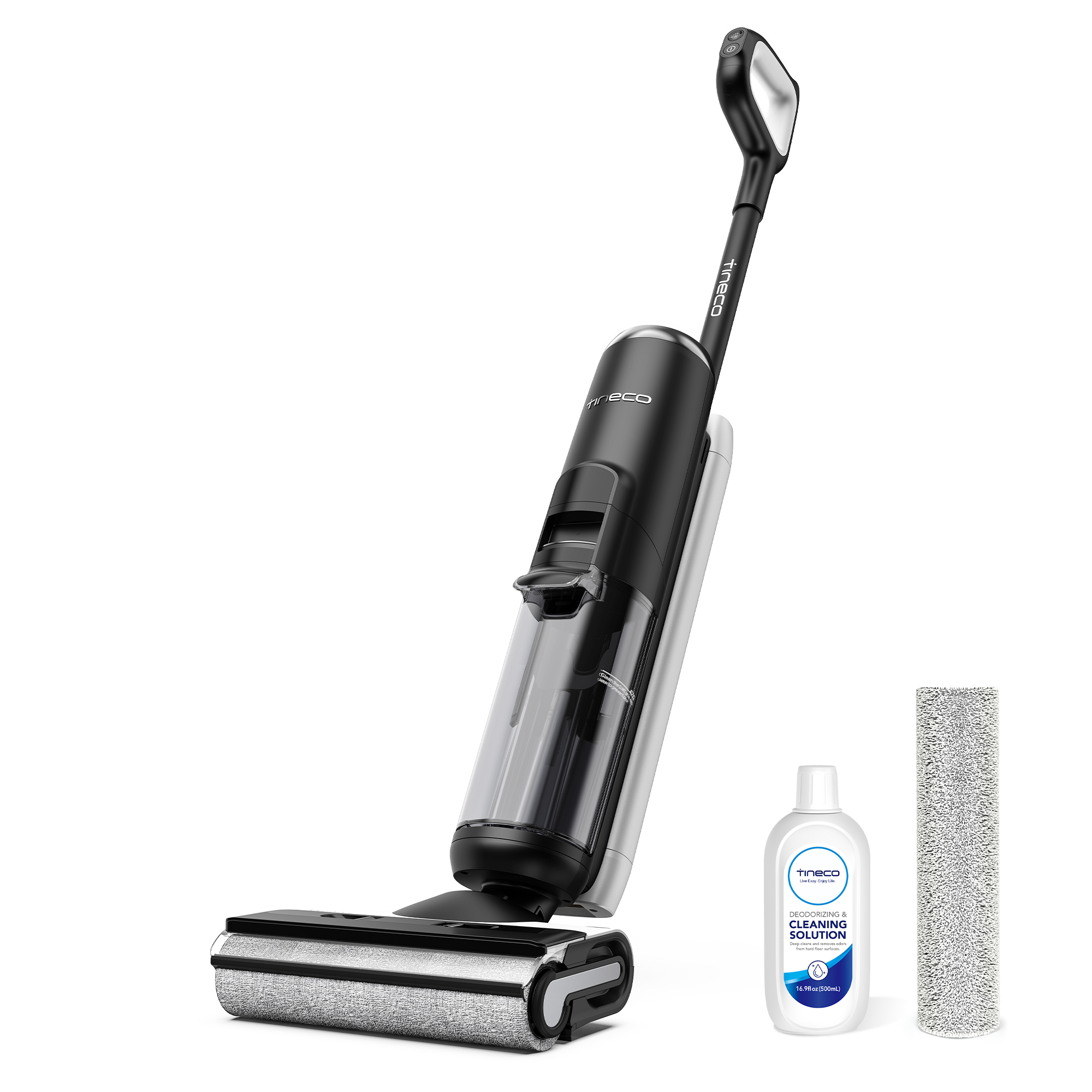 Ein schwarz-silberner Akkusauger mit Reinigungsmittelflasche und Ersatzbürstenrolle auf weißem Boden.
