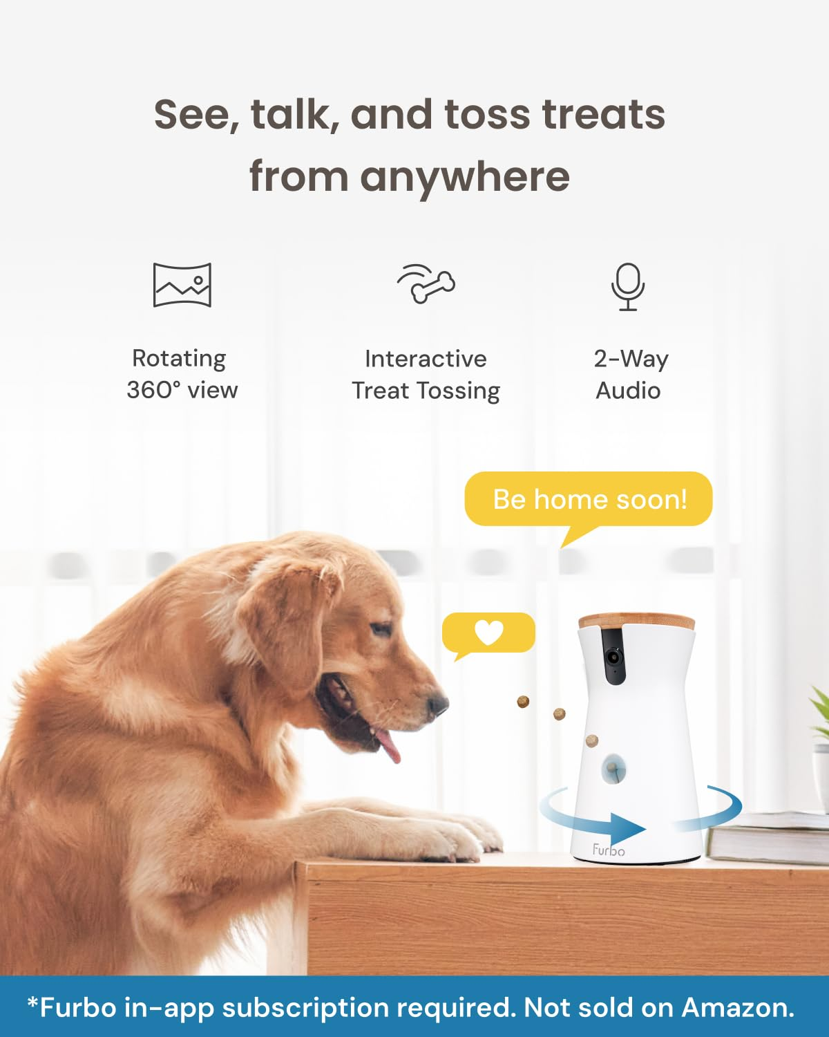 Un cane guarda una telecamera Furbo che lancia snack su un tavolo.