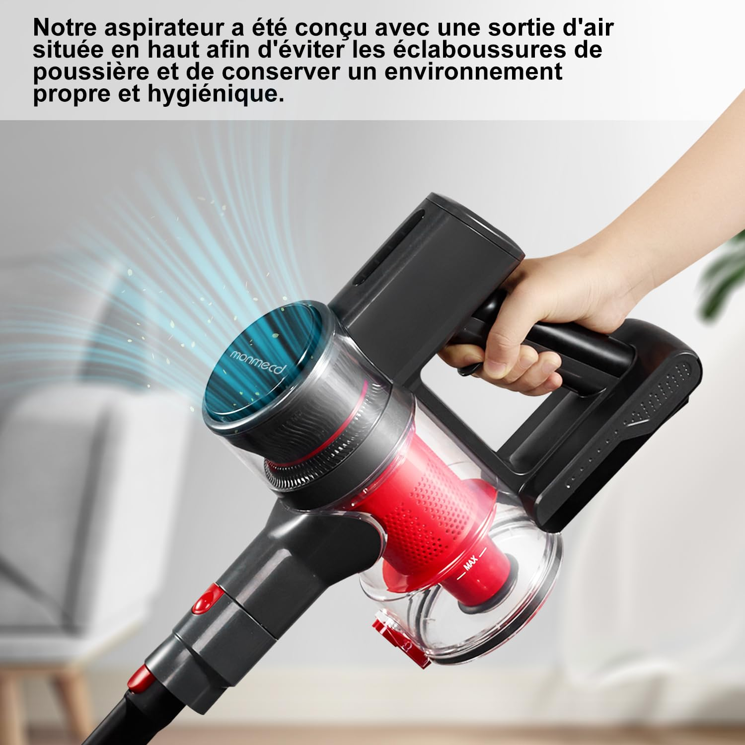 Mano che tiene un aspirapolvere senza fili nero e rosso con linee d'aria.