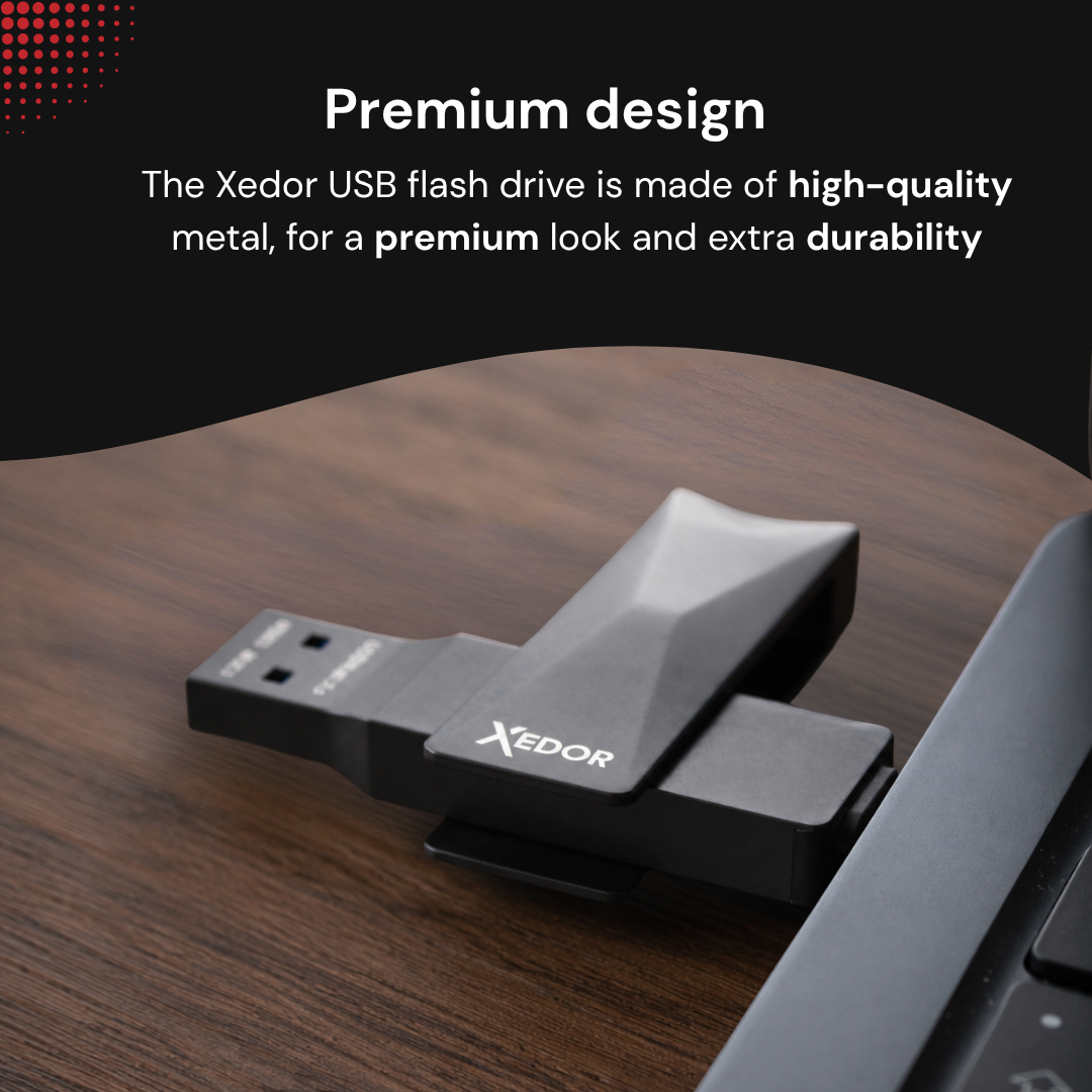 A Xedor USB flash drive plugged into a laptop on a wooden desk.