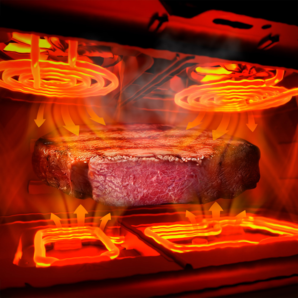 Un jugoso bistec se cocina en un horno con elementos calefactores rojos.