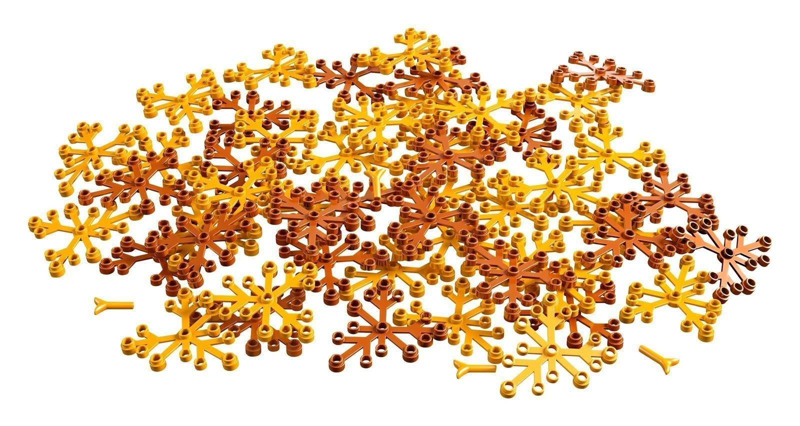 Ein Haufen goldene und braune Lego-Blumenteile auf weißem Hintergrund.