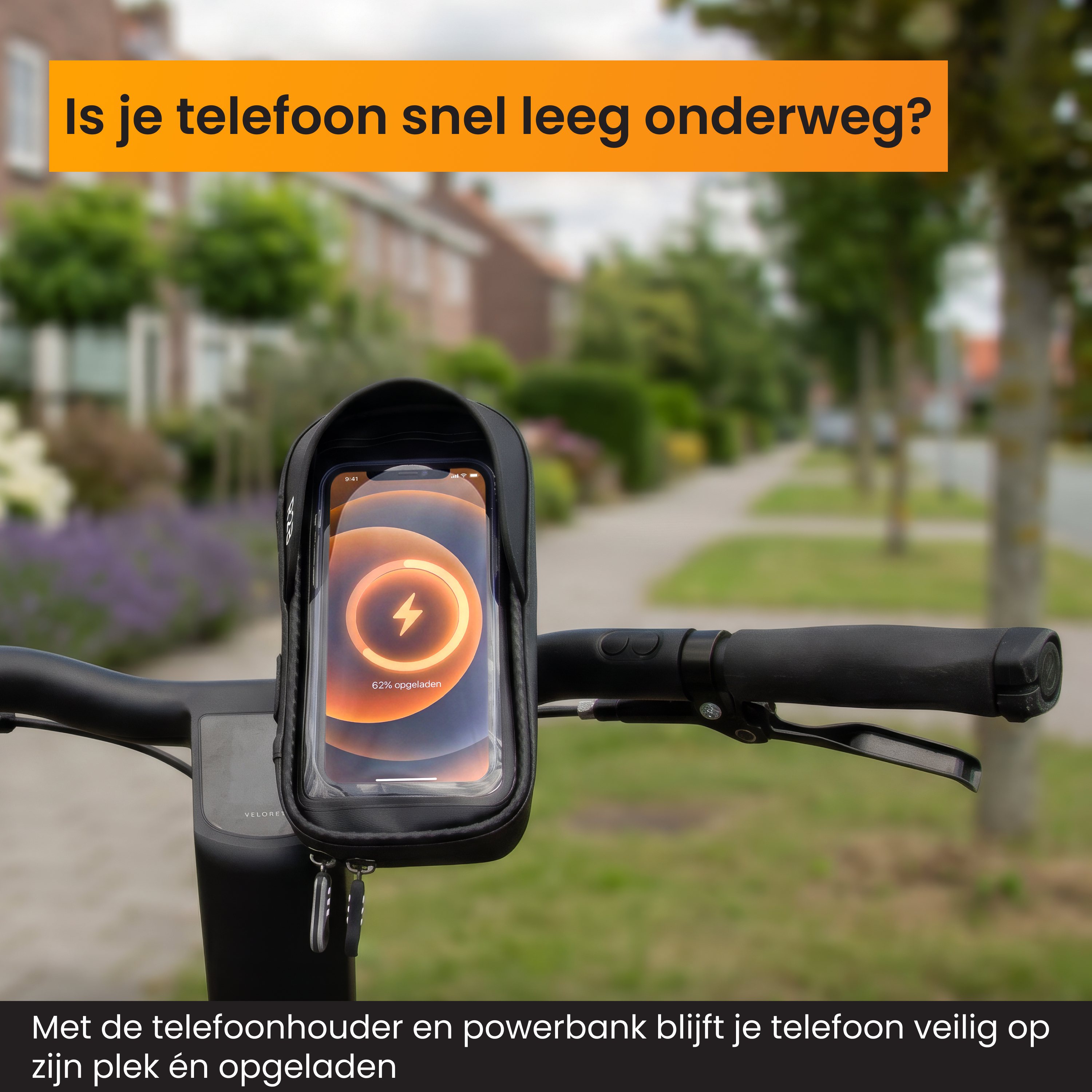 Fahrradlenker mit einer Smartphone-Halterung und angeschlossener Powerbank, im Hintergrund eine Straße.
