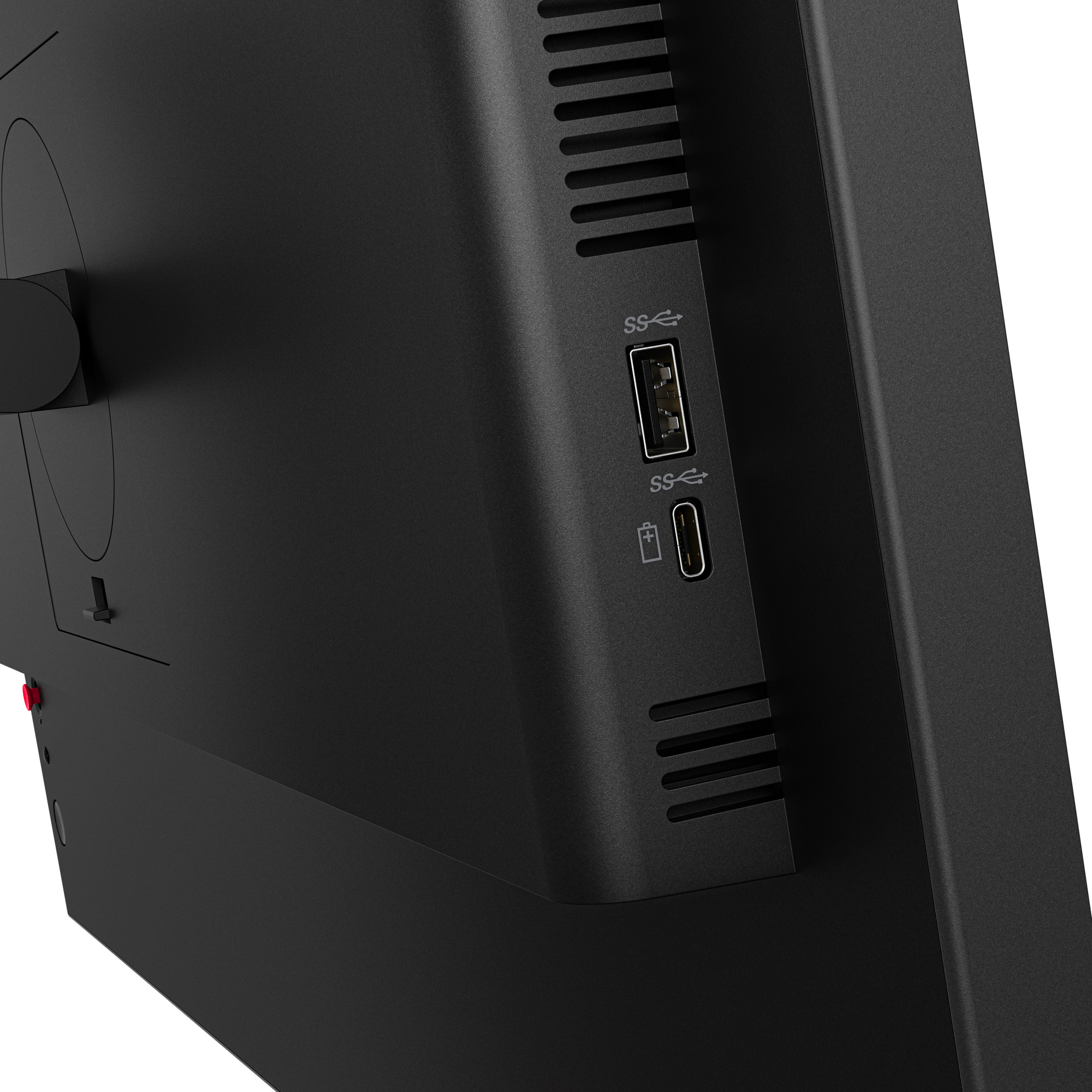 Rückseite eines schwarzen Monitors mit USB-A- und USB-C-Anschlüssen sowie Lüftungsschlitzen.