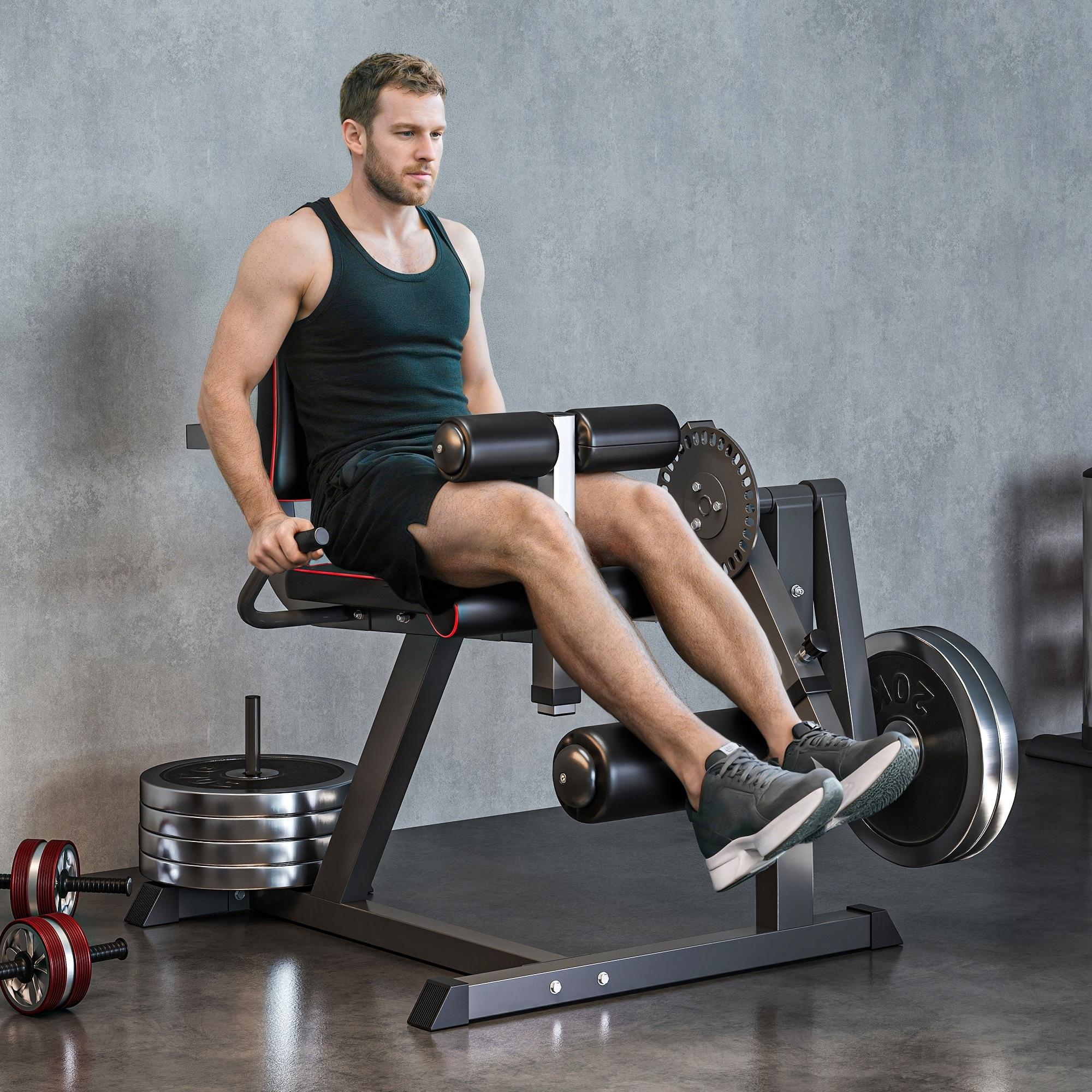 Un hombre con ropa deportiva se sienta en una máquina de extensión de piernas en un gimnasio.