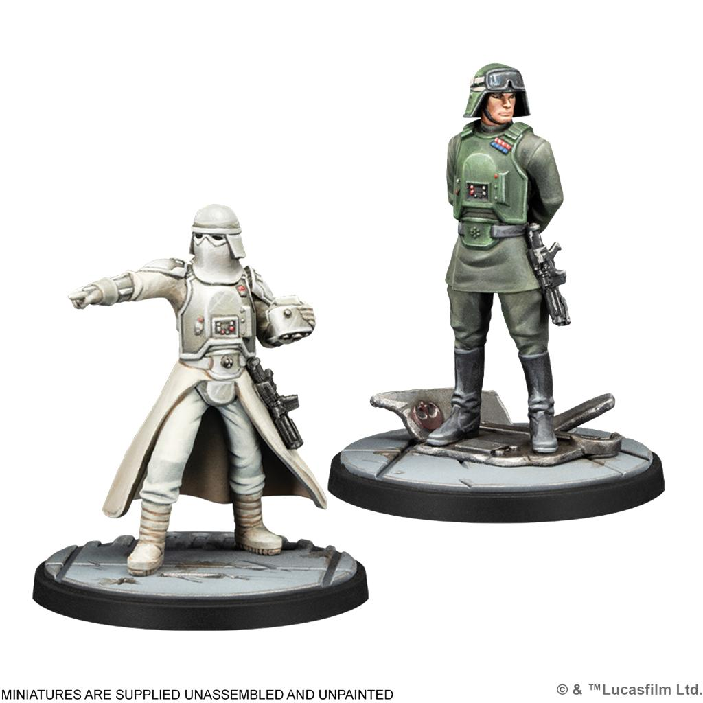 Dos miniaturas de Star Wars pintadas: un soldado de nieve blanco señalando y un oficial de verde en bases redondas.