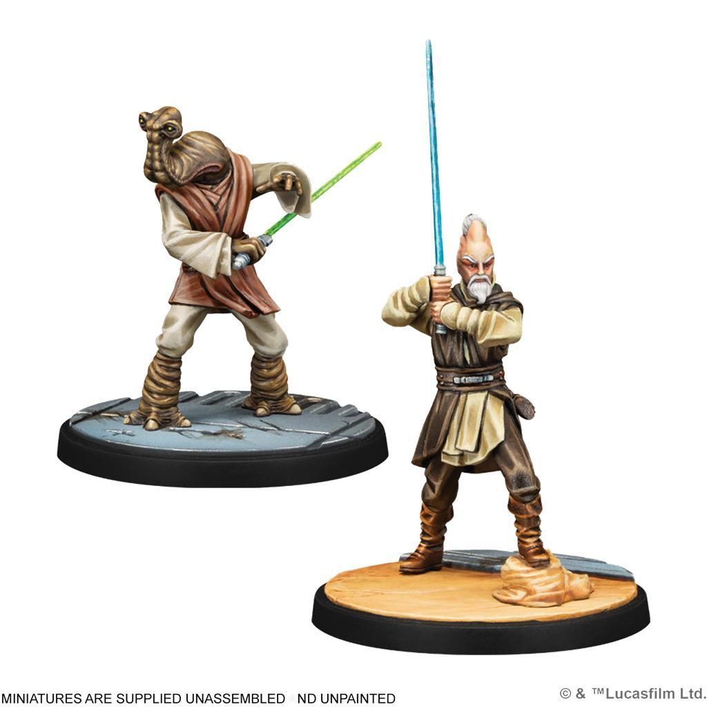 Dos miniaturas pintadas de Jedi de Star Wars sosteniendo sables de luz sobre bases redondas.