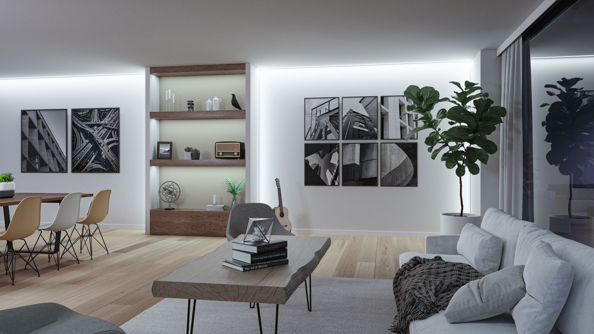 Modernes Wohnzimmer mit hellem Sofa, Holztisch, Pflanzen und schwarz-weißen Bildern an der weißen Wand.