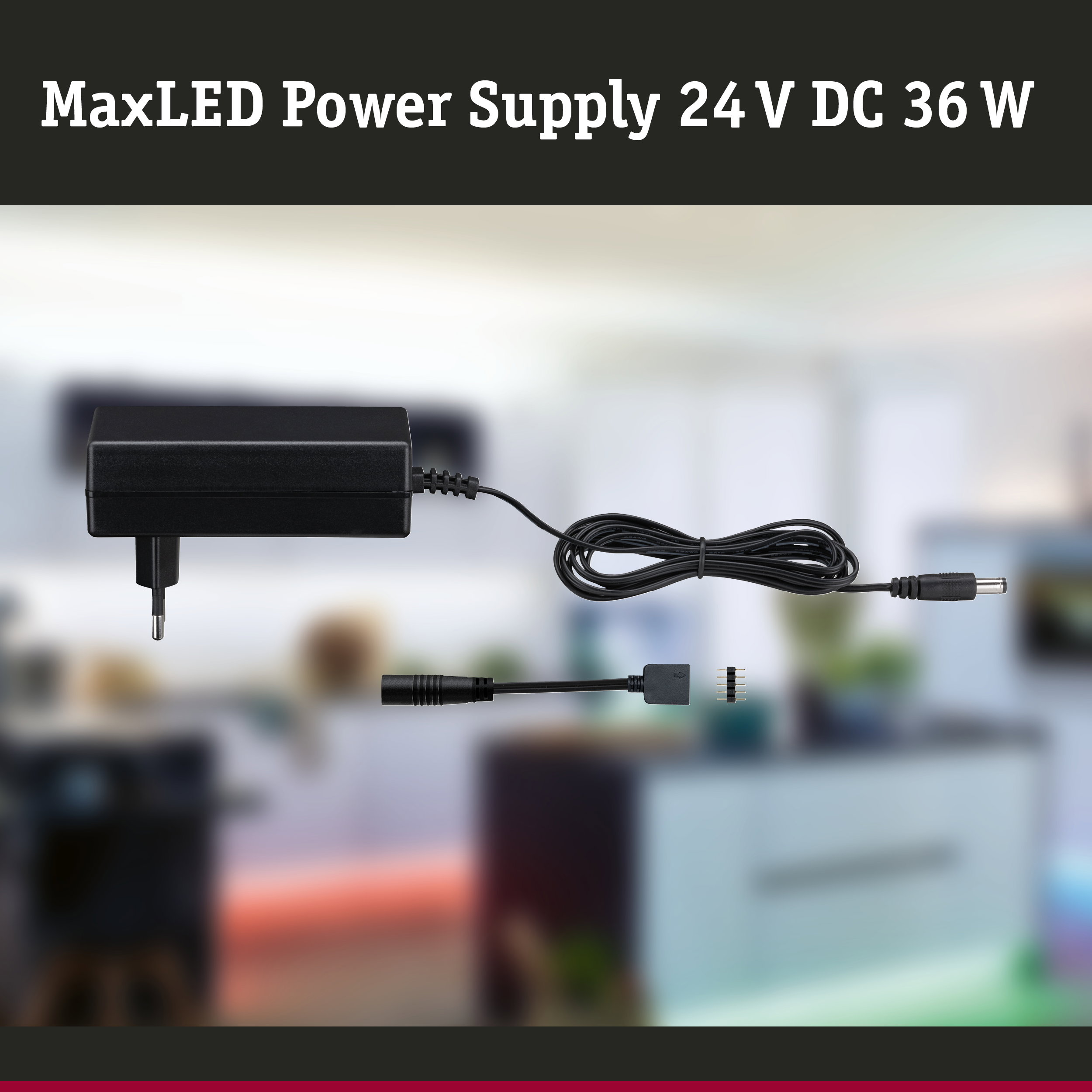 MaxLED-Netzteil 24 V DC 36 W mit schwarzem Kabel und Steckern vor verschwommenem Hintergrund.