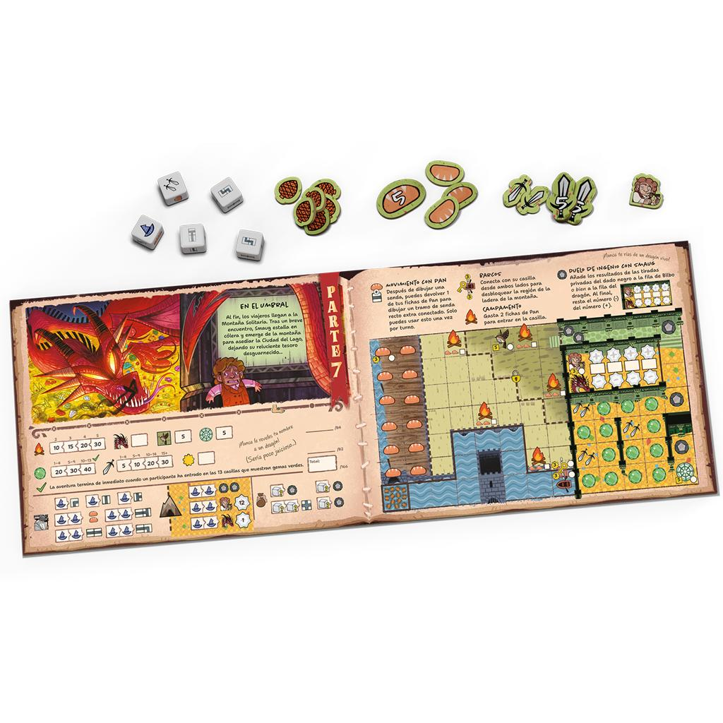 Un libro de reglas de juego de mesa abierto, dados y fichas de cartón que muestran un dragón rojo y mapas.