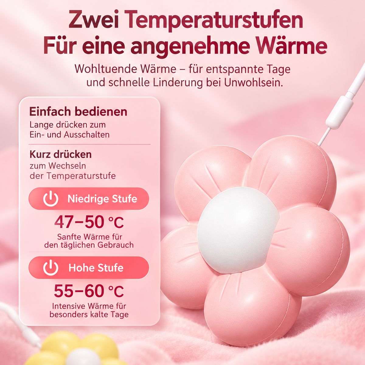 Rosa, blumenförmiges Heizkissen mit zwei Temperaturstufen und weißem Kabel auf rosa Untergrund.