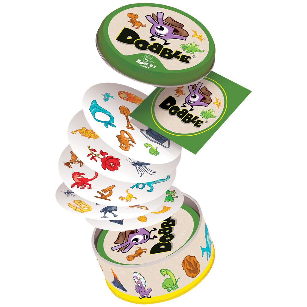 Juego de cartas Dobble con cartas redondas con iconos de dinosaurios coloridos, saliendo de una lata verde.